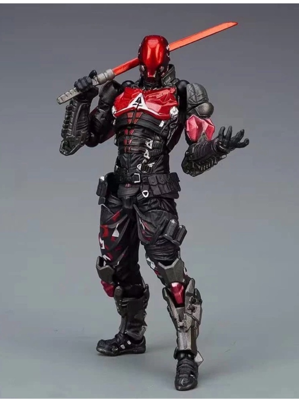 Blue and Black Armored Action Figure with Red Accents